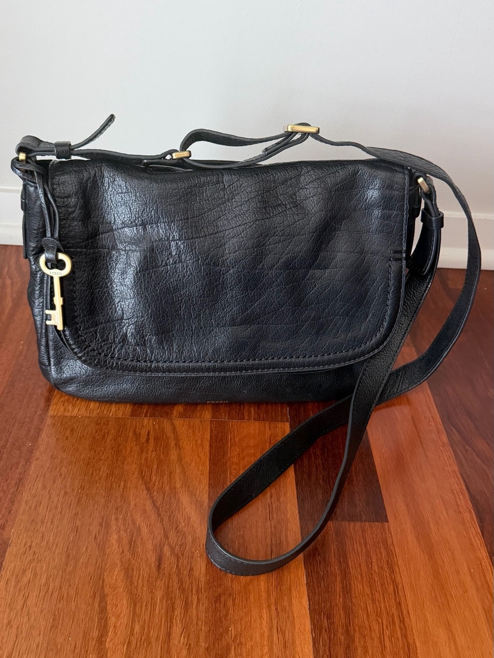 Fossil Black Leather Crossbody Bag with Gold Key Accent